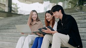 Asian Creative agency business people talking and sitting on steps at office tower,discussion and relax.Asian men and women as journalist with conversation,opinion and listening in workplace stairs - Powered by Shutterstock - Get 15% off with code: PIKWIZARD15