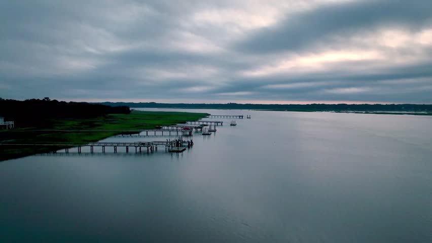 Aerial flyover of docks at sunrise in beaufort sc