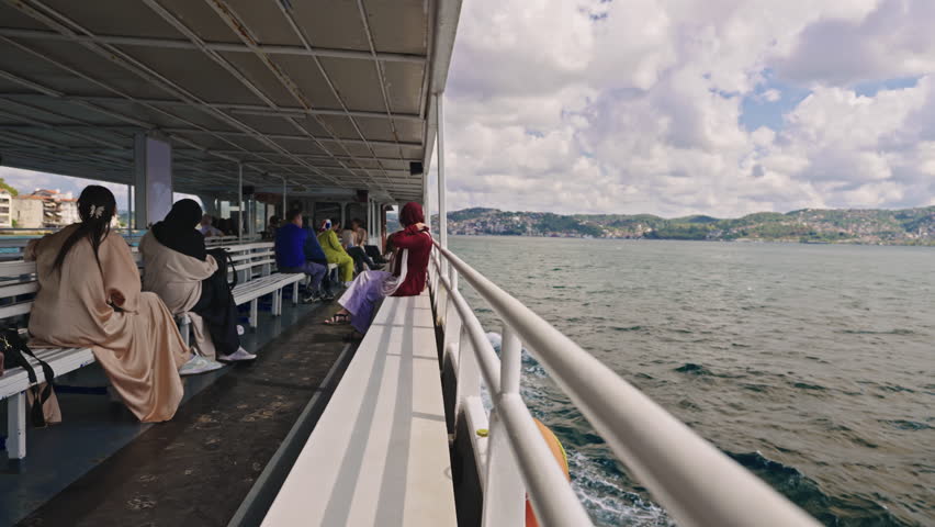 Tourists Sightseeing Istanbul from a Ferry Boat on Sunny Summer Day. Concept of Turkey Travel, Exploring, Vacation, Tourism, Cruise, Discovery, Journey, Enjoying, Holiday, Bosphorus Tour