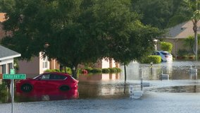 Tropical rainstorm flooded cars and residential homes in suburban community in Florida. Hurricane aftermath - Powered by Shutterstock - Get 15% off with code: PIKWIZARD15