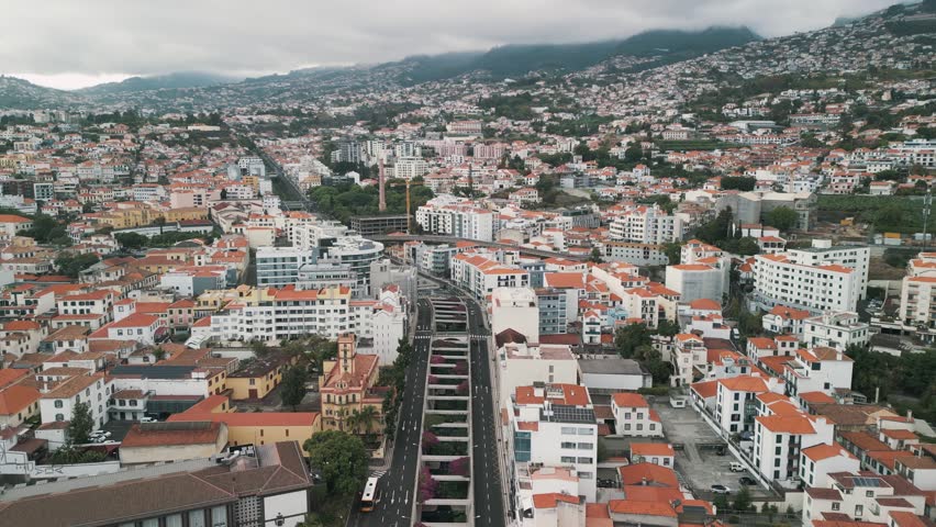 Drone aerial view of main street in Old Disctrict City of Funchal, Madeira Island, Portugal