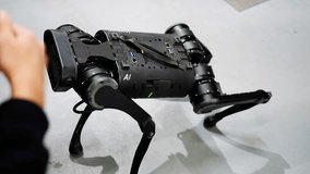 Adults and children interact with a robotic dog, showcasing innovative technology and design. - Powered by Shutterstock - Get 15% off with code: PIKWIZARD15