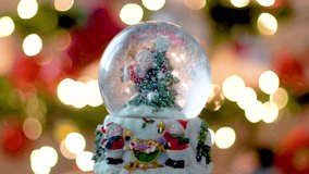 Christmas Snow flakes Globe, Christmas Tree and Lights in Out of Focus Background - Powered by Shutterstock - Get 15% off with code: PIKWIZARD15