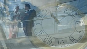 Clock animation over business people discussing work on glass balcony. teamwork, time management, deadline, corporate, strategy, planning - Powered by Shutterstock - Get 15% off with code: PIKWIZARD15