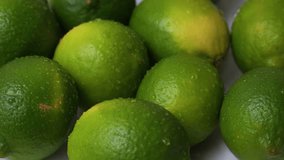 Lime green lemon citrus fruit fresh crips water splash drops up close rotating - Powered by Shutterstock - Get 15% off with code: PIKWIZARD15