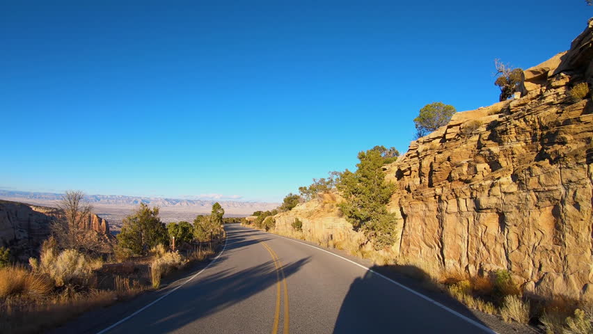 High Plains Plateau POV driving view of Colorado National Monument travel outdoor American West tourism USA