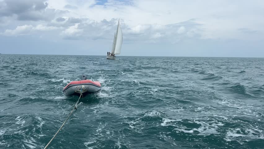 Sailing yacht in cloudy morning. Yacht tour. Sialing activity. Sailors men. Landscape, natural concept.