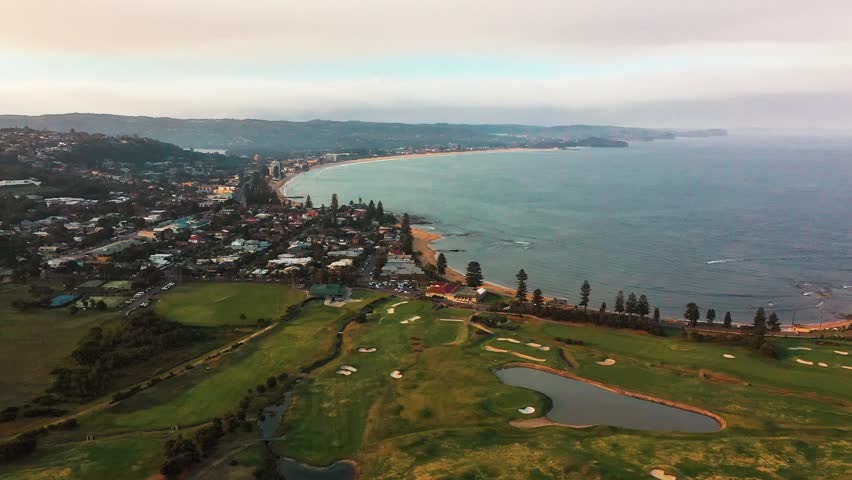 Aerial shot above coastal golf course in Longreef, Northern Beaches, Sydney, Australia on cloudy summer