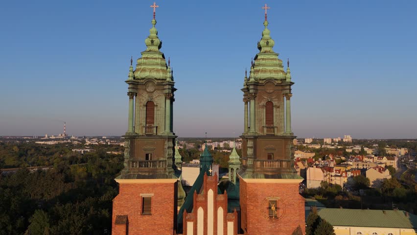 An aerial view of the spires and towers of the Cathedral of Saint Peter and Saint Paul during the afternoon in Poznan, Poland