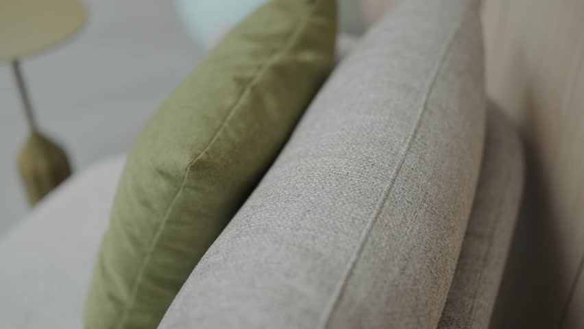 Close Up Textil Comfortable Sofa. Minimalist gray fabric sofa. Modern and Cosy House. Luxury Apartment. Modern Furniture in cozy Penthouse. Modern and Simple Sofa. Modern Living Room Interior.
