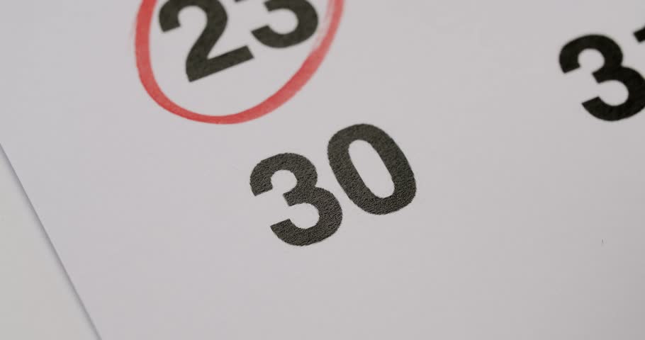 Close-up image of a calendar with the date number 30 circled in red, indicating an important event or deadline. The numbers 23 and 31 are also partially visible. Calendar Date Number Thirty