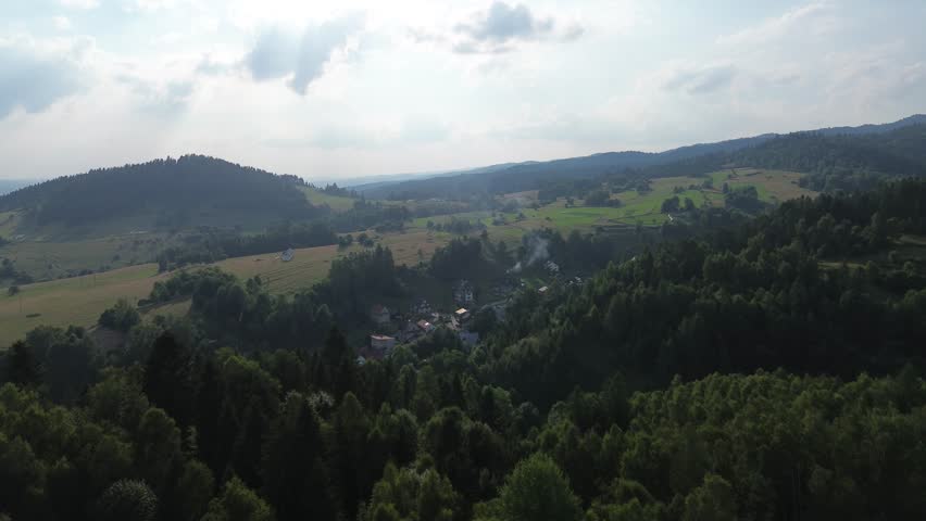 Beautiful rural landscape with fields and mountains in evening light