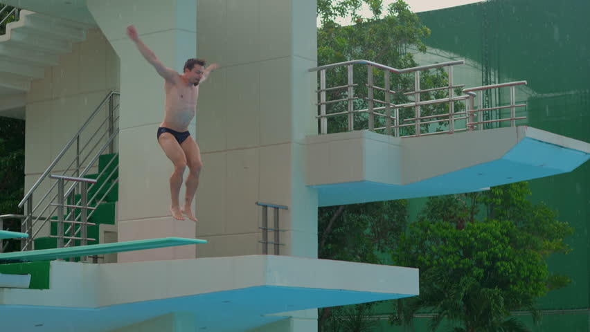 A professional athlete perfects his spring dive during training. The video showcases his dedication, technique, and athletic prowess as he practices each dive with precision and focus.