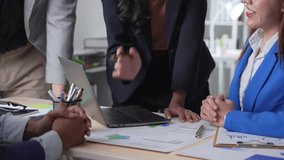 Business professionals collaborating in a meeting, discussing and finalizing a contract. A team of managers focuses on strategy and partnership to achieve success in the office - Powered by Shutterstock - Get 15% off with code: PIKWIZARD15