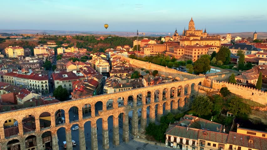 Sunrise aerial view of Segovia old town with roman aqueduct of Segovia, travel in Spain, drone view of Spanish town of Segovia, Roman ancient architecture