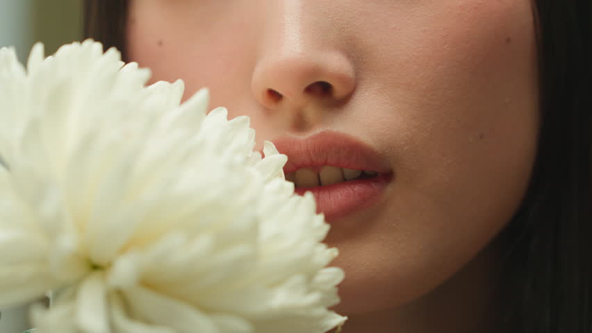 Close up unrecognizable Asian woman female girl chinese korean lady face smell flower natural organic cosmetics fresh fragrance blossom perfume skincare moisturizer cosmetology makeup beauty medical