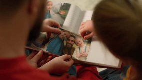 Back view Caucasian father little girls daughters school kids watching family album put photo collection memories parent man dad children watch pictures evening home weekend give high five teamwork - Powered by Shutterstock - Get 15% off with code: PIKWIZARD15