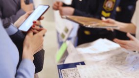 Process of checking in on conference congress forum event, registration desk table, visitors and attendees receiving lanyard with name badge and entry wristband bracelet and register electronic ticket - Powered by Shutterstock - Get 15% off with code: PIKWIZARD15