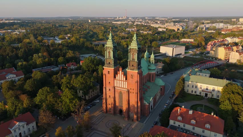 An aerial view of the spires and towers of the Cathedral of Saint Peter and Saint Paul during the afternoon in Poznan, Poland
