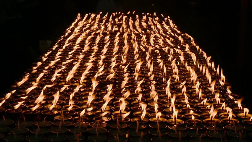 Light candles in Swayambhunath temple, Nepal. The faithful also light candles as a sign of gratitude to God for answered prayers.