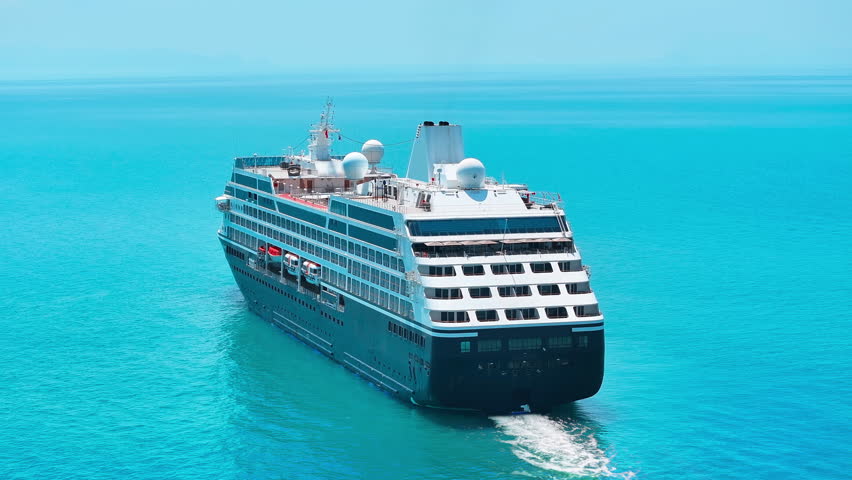Cruise ship in the sea. Cruise ship sailing in the ocean aerial view from above. Travel across ocean summer journey concept