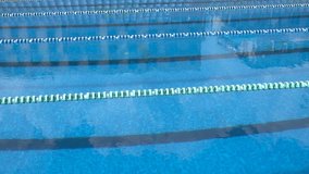 Slow motion of swimming pool with marked lanes.  - Powered by Shutterstock - Get 15% off with code: PIKWIZARD15