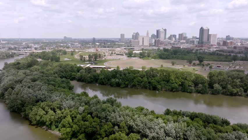 Wide view of Columbus, Ohio skyline with drone video moving in a circle.