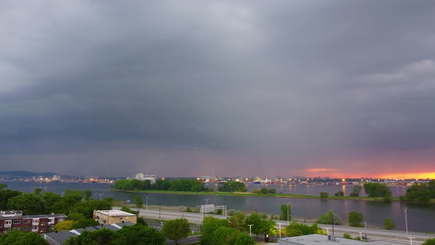 dark storm clouds gather for rainfall near the Loyola Campus, Concordia University, Montreal, Canada