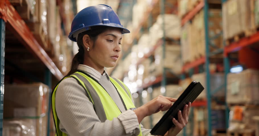 Happy woman, logistics and checklist with tablet for inventory, supply chain or distribution at storage. Female person, contractor or engineer smile on mobile smartphone for supply chain at warehouse