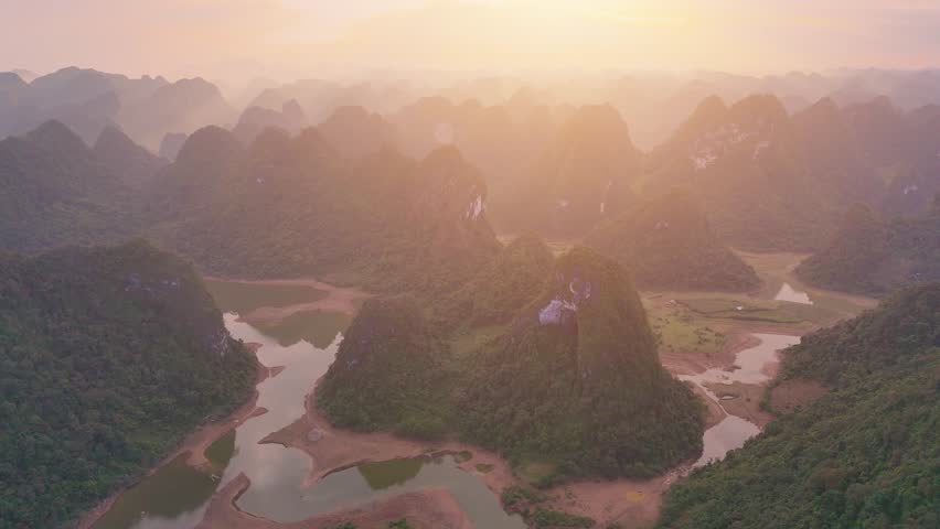 Aerial view of Thung mountain in Tra Linh, Cao Bang province, Vietnam with lake, cloudy, nature. Travel and landscape concept.