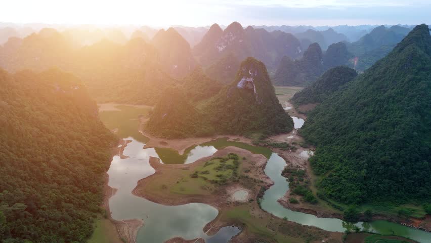 Aerial view of Thung mountain in Tra Linh, Cao Bang province, Vietnam with lake, cloudy, nature. Travel and landscape concept.