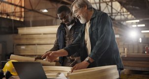 Teamwork, carpenter and laptop in workshop, apprentice and designer furniture manufacturing. Mentorship, carpentry and men at sustainable business, teaching and learning with computer for job project - Powered by Shutterstock - Get 15% off with code: PIKWIZARD15