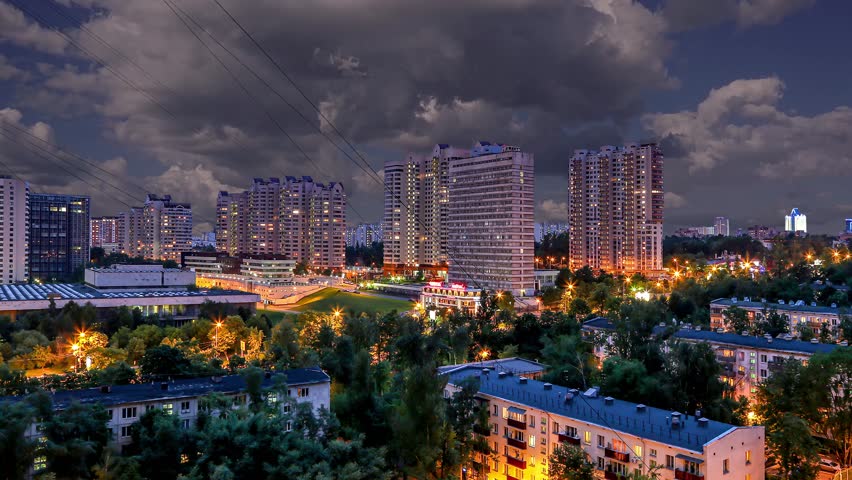 Aerial view of Moscow (night, against the background of a beautiful sky with clouds), Cheryomushki district near Profsoyuznaya metro station, Russia. 4K, time lapse 