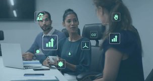 Animation of ecology icons and data processing over diverse colleagues discussing work in office. Global business and digital interface concept digitally generated video. - Powered by Shutterstock - Get 15% off with code: PIKWIZARD15
