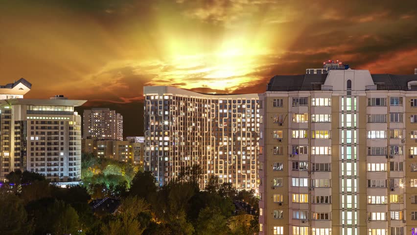 Aerial view of Moscow (night, against the sunset), Cheryomushki district near Profsoyuznaya metro station, Russia. 4K, time lapse, zoom 
