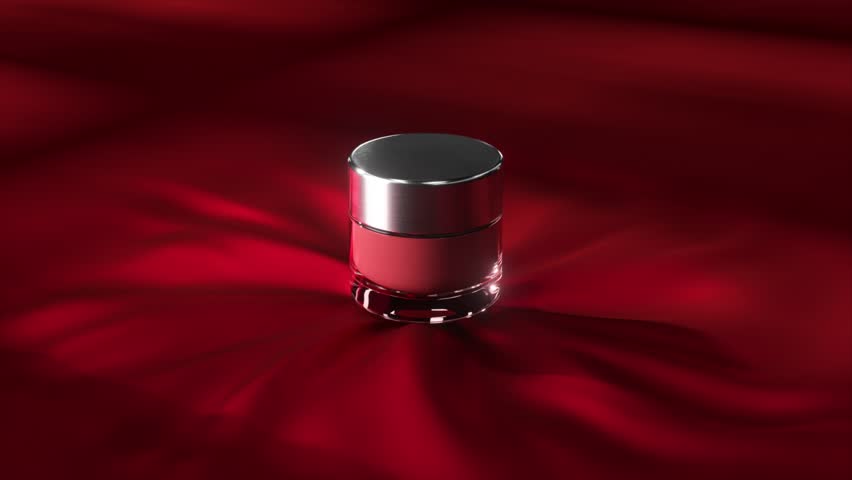 High-end cosmetic container elegantly placed on vibrant red silk fabric, creating a luxurious and stylish visual experience for beauty product advertisement