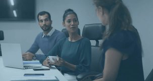 Animation of data processing over diverse colleagues discussing work in office. Global business and digital interface concept digitally generated video. - Powered by Shutterstock - Get 15% off with code: PIKWIZARD15
