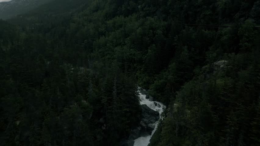 Aerial drone footage flying over Skagway River, Alaska