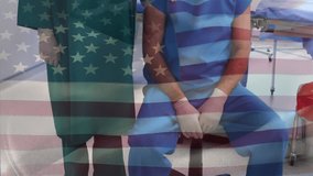 Animation of flag of usa over diverse surgeons in face masks. American medicine, patriotism and connections concept digitally generated video. - Powered by Shutterstock - Get 15% off with code: PIKWIZARD15