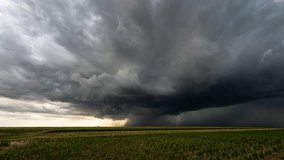 A heavy rainstorm engulfs the sky as powerful dark storm clouds loom ominously, creating a dramatic and intense atmosphere. - Powered by Shutterstock - Get 15% off with code: PIKWIZARD15