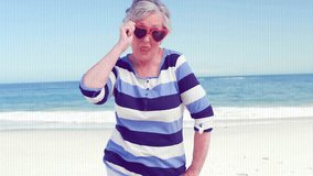 Animation of camera digital interface over senior caucasian woman having fun on beach. Digital interface, lifestyle, happiness, vacation and summer concept digitally generated video. - Powered by Shutterstock - Get 15% off with code: PIKWIZARD15