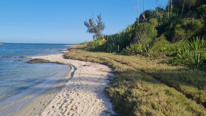 Praia das Andorinhas, Iguaba Grande, Rio de Janeiro, Brazil. A serene beach in Araruama Lagoon in a protected area, cristal clear waters, native vegetation and a tropical charming scenery.