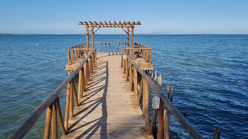 Praia das Andorinhas, Iguaba Grande, Rio de Janeiro, Brazil. A serene beach in Araruama Lagoon in a protected area, cristal clear waters, native vegetation and a tropical charming scenery.