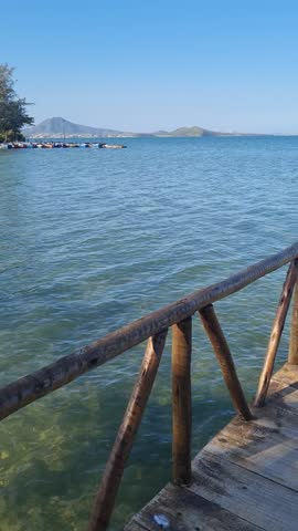 Praia das Andorinhas, Iguaba Grande, Rio de Janeiro, Brazil. A serene beach in Araruama Lagoon in a protected area, cristal clear waters, native vegetation and a tropical charming scenery.