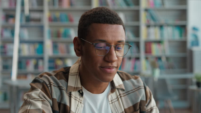 African American man guy student e-learning finish stop task done high school online laptop computer gadget smile educate internet completion work achievement deadline pride library happy male study