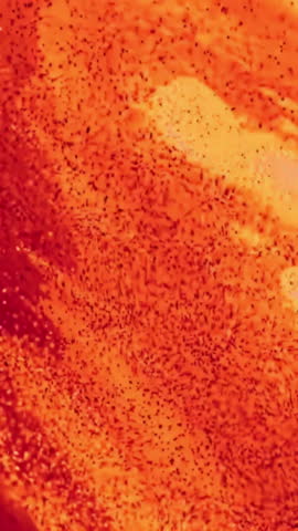 Close-up of bright melt at steel plant. Stock footage. Beautiful bright metal melt flows in industrial furnace at metallurgical plant. Flow of metallurgical molten