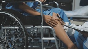 Asian female physiotherapist helping senior older woman stretching hamstring, Rehabilitation physiotherapy, elderly. Causes knee pain, swelling, redness, stiffness in knee, clunking noise in knee. - Powered by Shutterstock - Get 15% off with code: PIKWIZARD15