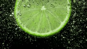 Super Slow Motion Shot of a Lime Slice in Water with Air Bubbles , Filmed with High Speed Cinematic Camera - Powered by Shutterstock - Get 15% off with code: PIKWIZARD15