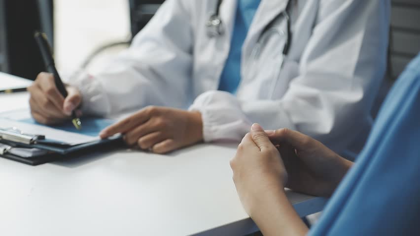 Women Asian doctors hold the patient hand and encourage and provide medical advice While checking the patient health in bed. Concept of Care and compassion, antenatal care, Threatened abortion