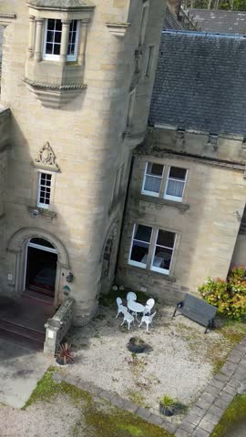 facade front medieval historic castle hotel scotland uk circling vintage close up aerial travel attraction old landmark national hill kingdom architecture street tourist scenery monument